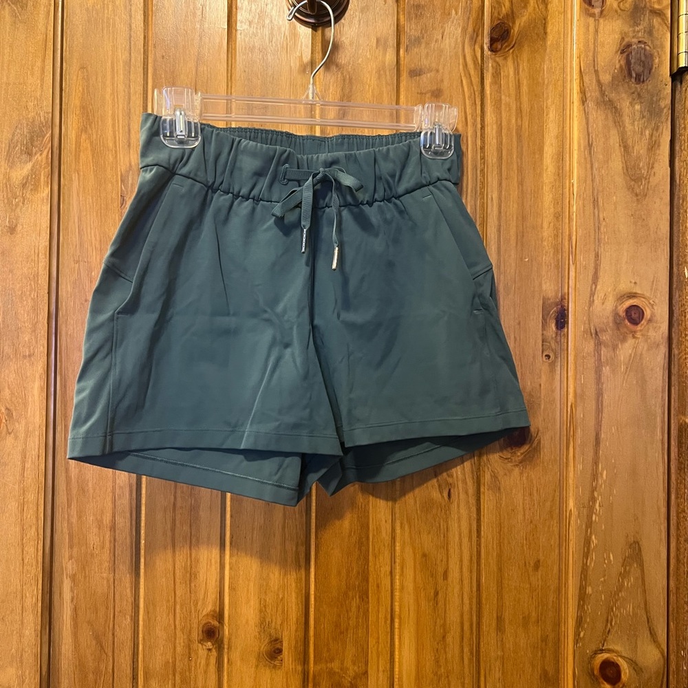 Womens lululemon shorts with pockets, teal green/gray, size 4